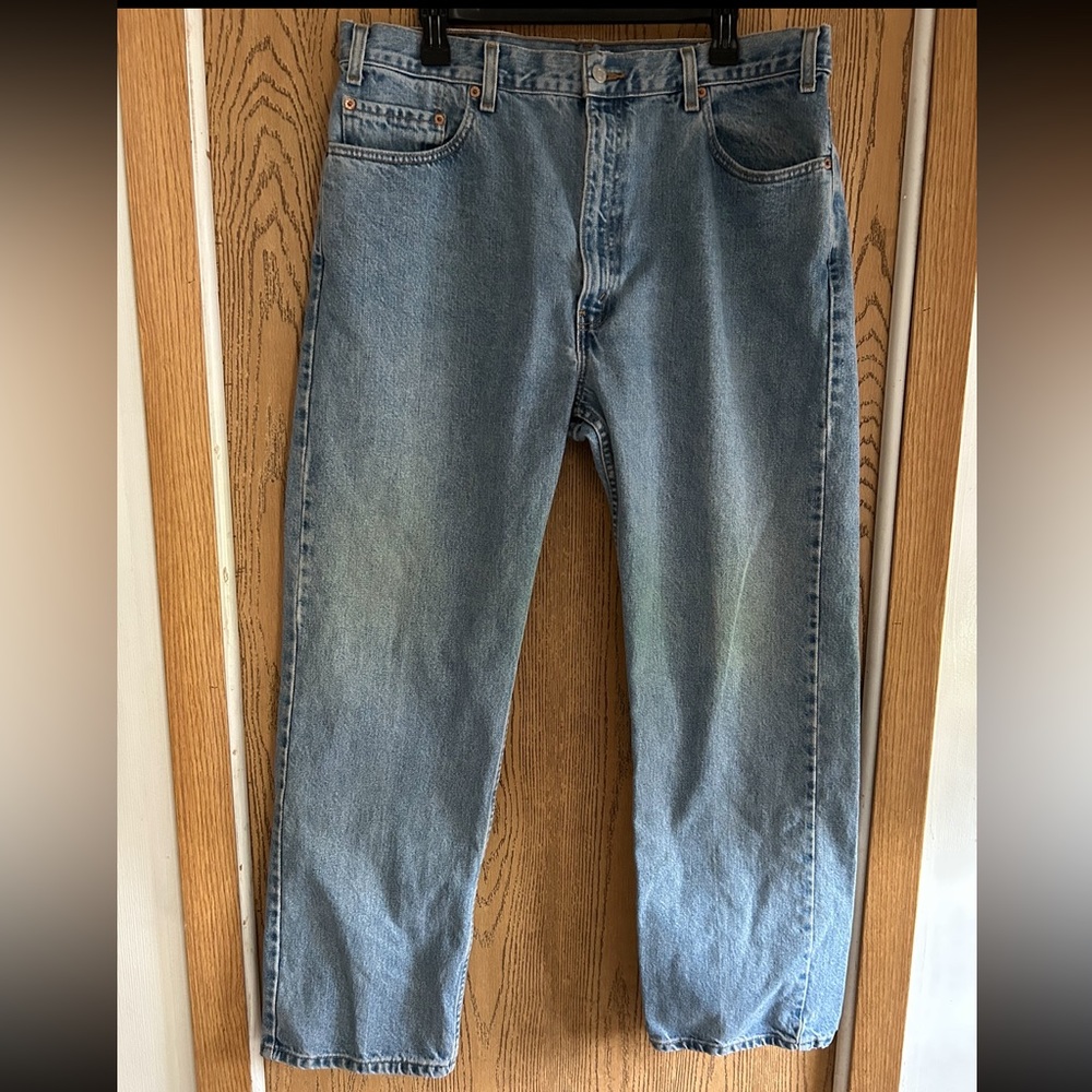 Levi straight leg jeans size 40 in a light blue wash.